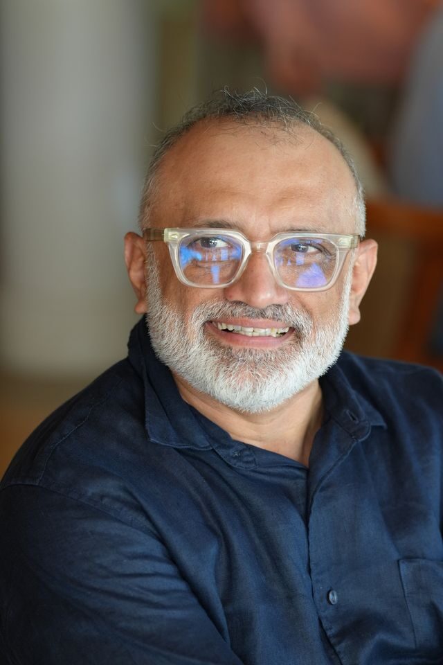 Abhijit Bhave smiling, close portrait